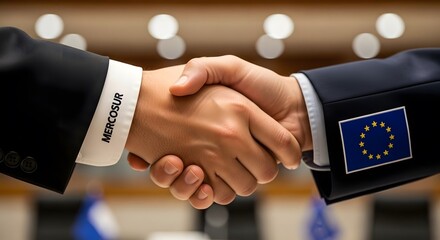 Two businessmen shaking hands in a formal setting, representing a partnership between Mercosur and the European Union