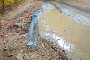 Bottle of clean water in nature.