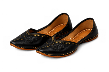 Pair of black traditional mojari jutti shoes with rich embroidery, cultural ethnic footwear on transparent background