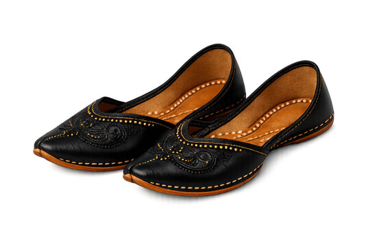 Pair of black traditional mojari jutti shoes with rich embroidery, cultural ethnic footwear on transparent background