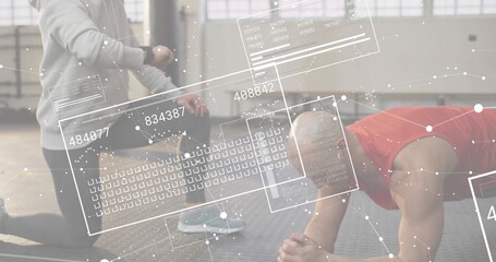 Holding forearm plank, trainee in red top at warehouse gym, with wrist tracker and HUD overlays
