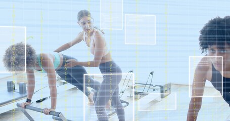 Assisting coach guiding two women in leggings on reformers doing kneeling moves in studio with grid