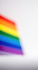 Fototapeta premium Abstract composition of vibrant rainbow colors representing pride and equality against a clean, bright white canvas for copy space and design work ,pride ,flag colors ,backdrop