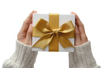 Close view of human hands unveiling present tied with golden ribbon for festive happiness and excitement isolated on transparent background PNG