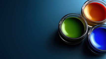 Three jars with colored liquids on a blue surface in bright light