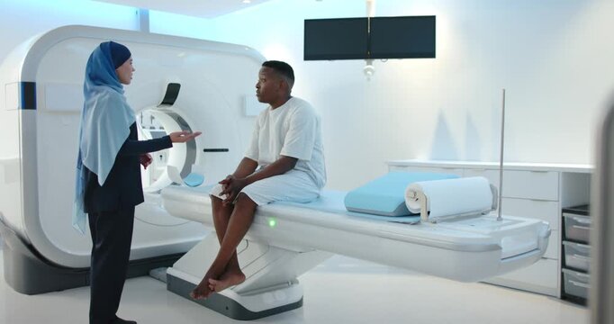 Clinician initiating prescan, pointing at gantry and exam table while patient listening in CT room