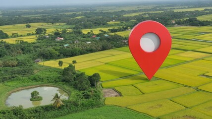 Giant red map pin graphic superimposed over an expansive aerial view of vibrant green and yellow agricultural rice fields in a rural landscape setting
