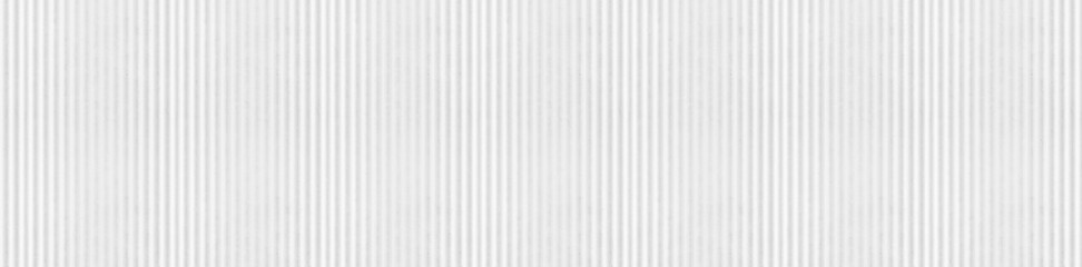 Wide gray white marble background with vertical ribbed texture and linear stone relief