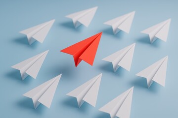 Leadership in Flight: A vibrant red paper airplane takes center stage, soaring above a squadron of white counterparts against a cool blue backdrop. It symbolizes leadership, innovation.