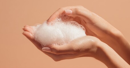 Fototapeta premium The Hands Holding Soap Foam on Neutral Background for Skincare and Hygiene