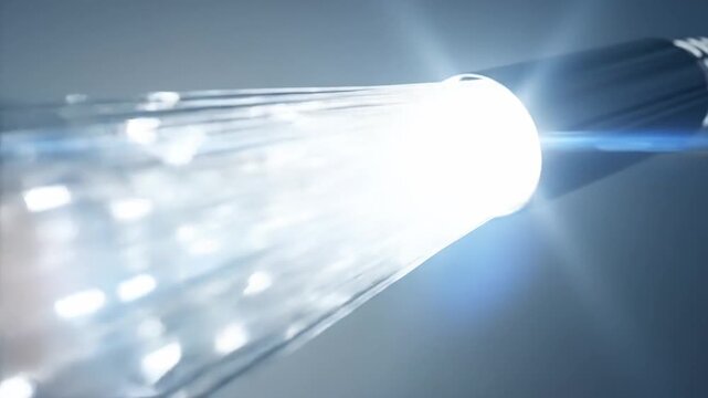 Fiber optic cable transmitting data with light, representing high-speed internet and technology.