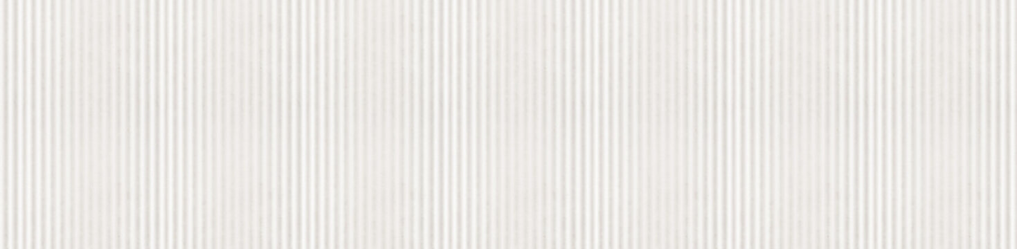 Panoramic beige and white marble texture with vertical ribbed stripes and stone relief