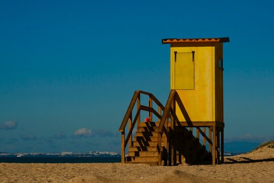 Yellow Lifeguard Hut on the beach of the island of Faro (Praia do Faro), Faro, Algarve, Portugal, Europe