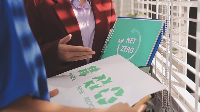 Close up of business people shaking hands over ESG strategic commitment workshop, SDGs report, global warming, green finance investment eco friendly and net zero waste in boardroom training building.