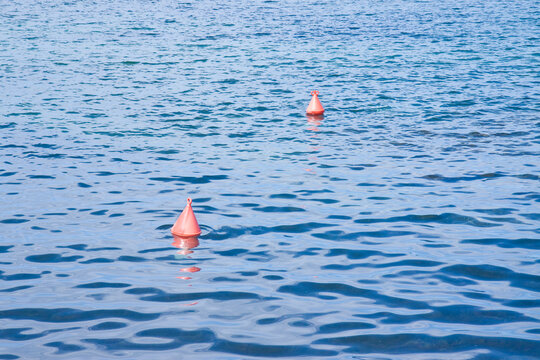 Plastic red bouy on a calm lake - concept image with copy space