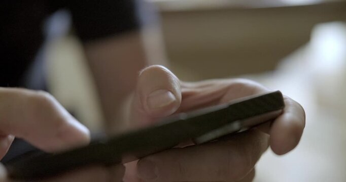 Man playing mobile phone close-up. High quality 4k footage