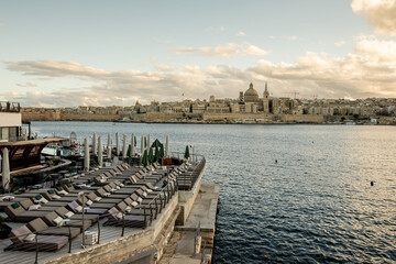 Stunning sunset view of Valletta from the Sliema seafront in Malta