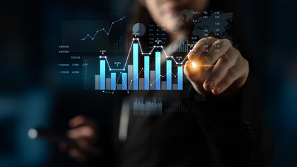 A businessman interacts with a digital interface displaying financial data and analytics, showcasing vibrant charts and statistics for strategic business insights. Scalp