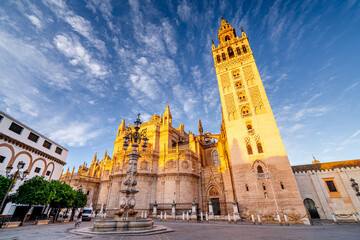 Gothic Cathedral of Our Lady of Seville with Giralda Tower illuminated in the morning, Andalusia, Spain. © Tomasz