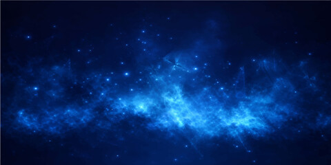An abstract blue cosmos background features a glowing nebula and bright starry light within a deep dark space galaxy illustration © alien
