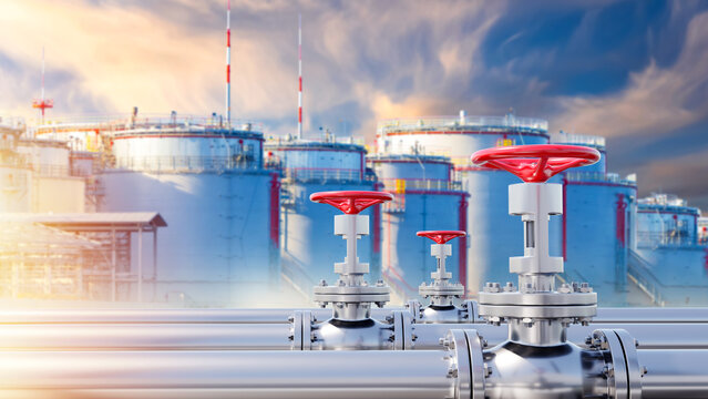 Oil and gas storage infrastructure. Industrial pipelines with control valves in foreground and large fuel storage tanks in background, representing energy production, distribution, industrial safety.