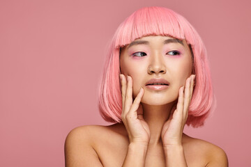 Beautiful young woman with pink hair showcasing fashion elegance and expressive beauty