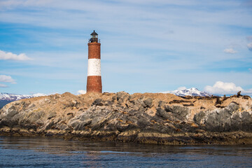 The lighthouse "Faro Les &Eacute;claireurs", a landmark on a rock with sea lions near Ushuaia, Tierra del Fuego