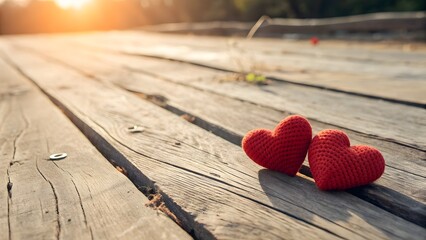 Two Vibrant Red Heart Shapes on Wooden Deck with Golden Sunset Light, Romantic Symbol