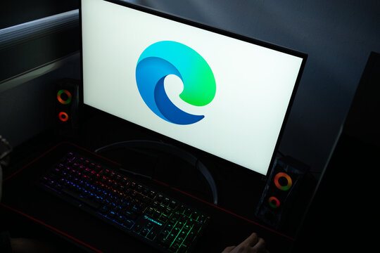 Punta Arenas, Chile &ndash; January 20, 2026: Close-up of the Microsoft Edge web browser icon on a PC screen with an RGB mechanical keyboard
