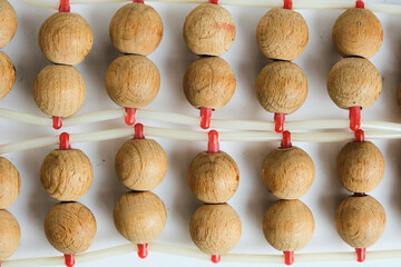 Background, wooden roller massager closeup.