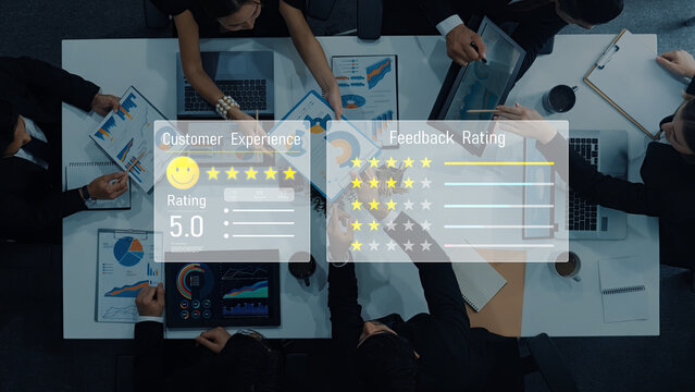 A diverse team of professionals collaborates in a modern office, assessing customer experience and feedback ratings using charts, laptops, and digital tools to enhance performance. Trope - Powered by Adobe