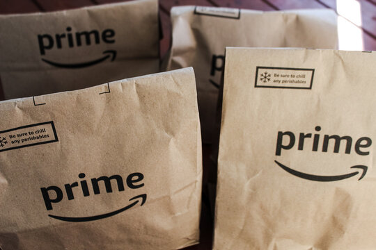 Amazon Prime grocery bags delivered, with a reminder to chill perishable items upon receipt. (Minneapolis, USA - Jan. 13, 2026). Editorial Use Only.