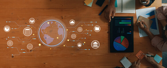 A workspace featuring data analysis and visualization tools with charts and a globe layout, representing modern business insights and decision-making processes. Trope