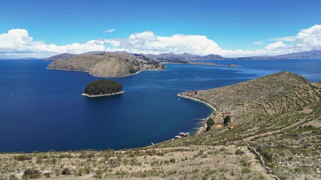 Isla del Sol, Bolivia: Aerial drone footage of the Isla del sol, the sun island, on the lake Titicaca in the Andes with Copacabana and the mainland in the background in the Bolivia