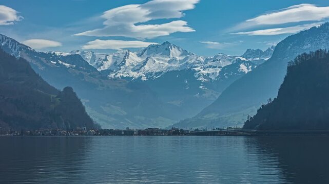 Time lapse, lake in the mountains, view from Hergiswil towards Stansstad and Brisen mountain peak. Lake Lucerne, Vierwaldstaettersee, canton Nidwalden, Switzerland.