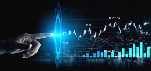 A close-up of a hand pointing at a digital financial graph, showcasing upward trends and data metrics in a dark environment, symbolizing investment opportunities. Scalp