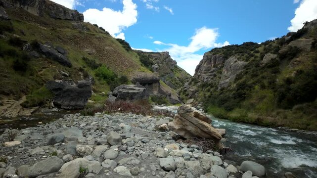 Rocky Riverbank In Mountain Canyon With Fast Stream