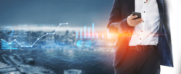A businessman in a suit interacts with his smartphone against a dynamic city skyline. Data and financial visuals emphasize the connection between technology and growth. Scalp