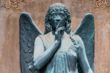 Monument of old angel in Catholic cemetery.