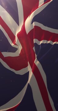 Flag of United Kingdom at sunset. 4K Vertical. Loop
