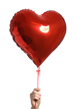 Woman with red-heart shaped balloon on white background, closeup