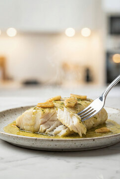 Close Up Fork with Cod Pil Pil Fish
