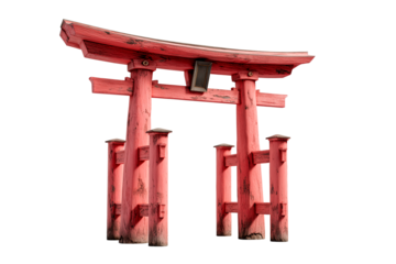 Traditional Japanese red wooden Torii gate standing tall in a simple outdoor setting with clear skies and natural light