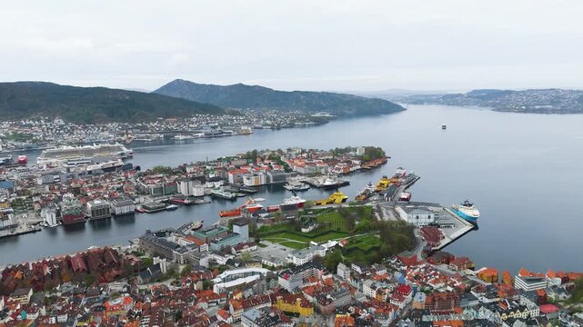 peninsula city old stone modern glass architecture specialized maritime ships ferries fill busy port norway bergen center urban landscape settlement blend historic nordic 