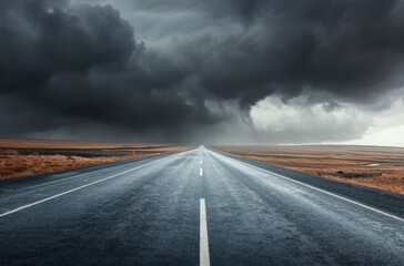Lonely Rainy Road Under Dark Clouds in a Mountainous Landscape