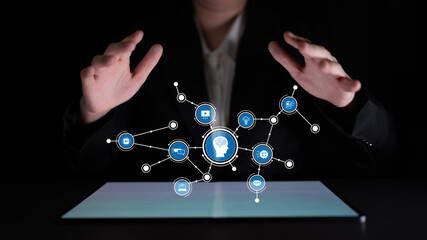 A pair of hands appears to manipulate floating digital icons related to technology and innovation, creating an engaging atmosphere that showcases the potential of future advancements. Tessel