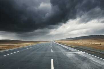 Fototapeta premium Lonely Highway Under Dark Clouds in an Open Landscape