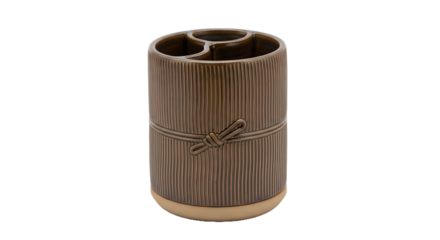 A brown ceramic desk organizer with a unique design on a black background