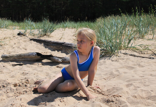 Seaside lifestyle portrait of a girl during summer holidays