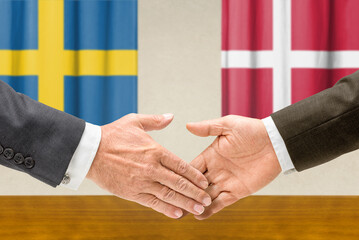 Symbolic cooperation concept &ndash; Sweden and Denmark handshake